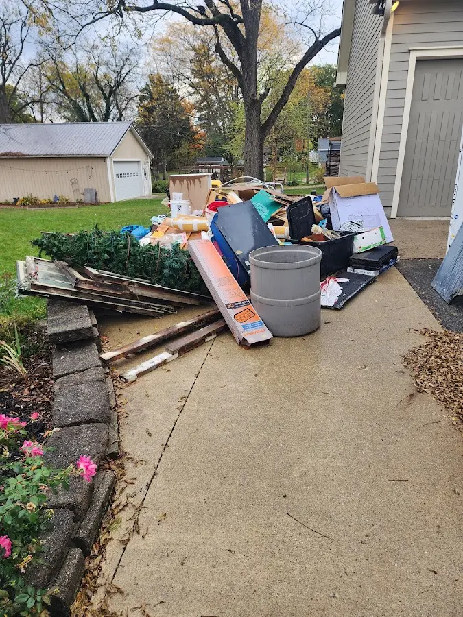 Dumpster being loaded with debris for Residential Dumpster Rental in Lackland AFB